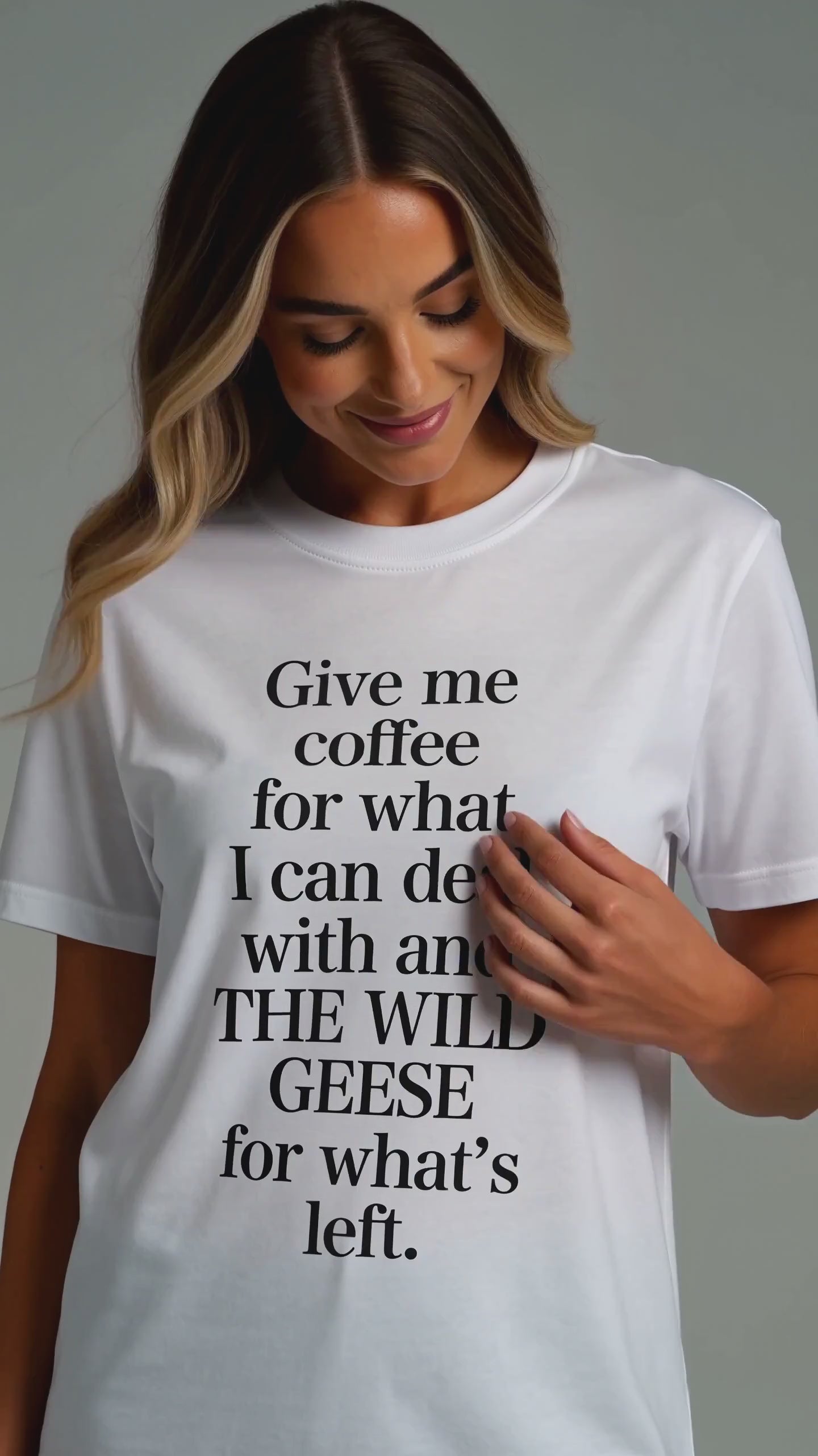 Model wearing The Wild Geese Give Me Coffee white t-shirt, studio video