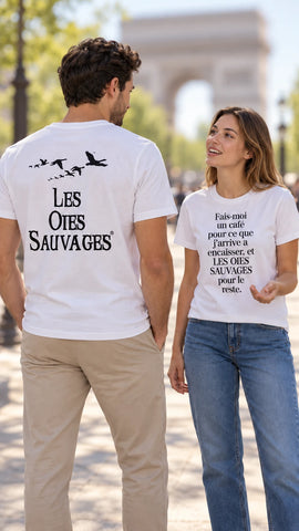 Couple on the Champs-Elysees wearing Les Oies Sauvages t-shirts, back logo and Fais-moi un cafe slogan