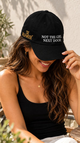 Woman wearing The Wild Geese Not the Girl Next Door black embroidered cap