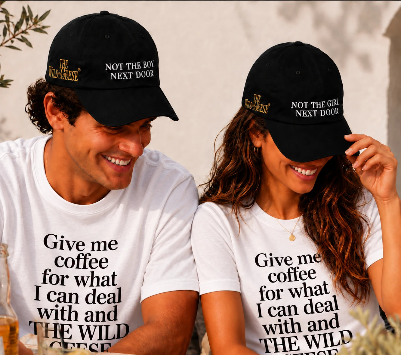 Couple wearing The Wild Geese Not the Girl and Not the Boy Next Door black caps