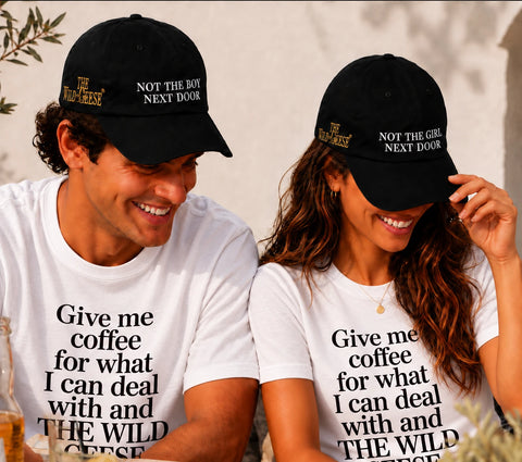 Couple wearing The Wild Geese Not the Girl and Not the Boy Next Door black caps
